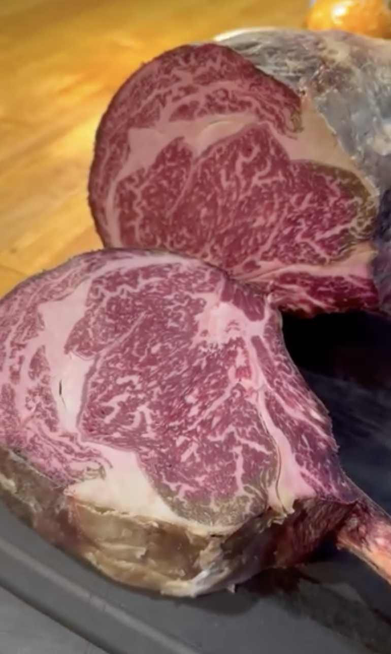 TAR. A tomahawk cut dry-aged in the premium meat dry-aging equipment with a wall of Himalayan salt.
